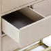 Close-up of Bronwyn bar cabinet drawer in ash veneer with clean joinery detail