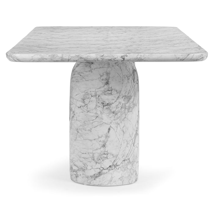 Bryson dining table, end view showing cylindrical pedestal base and white marble-look top