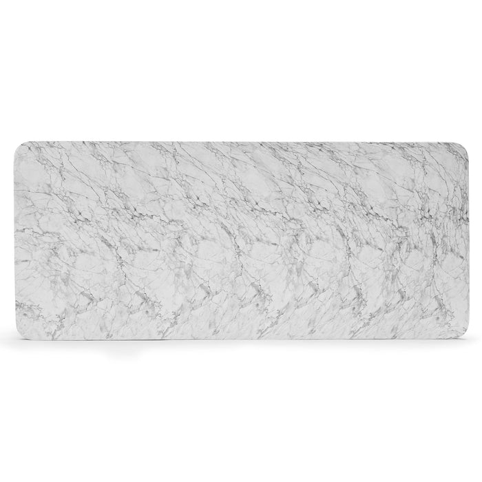 Detail of Bryson dining table showing white marble-look surface with natural veining pattern