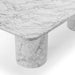 Detail of Bryson dining table showing rounded edge and white marble-look concrete surface