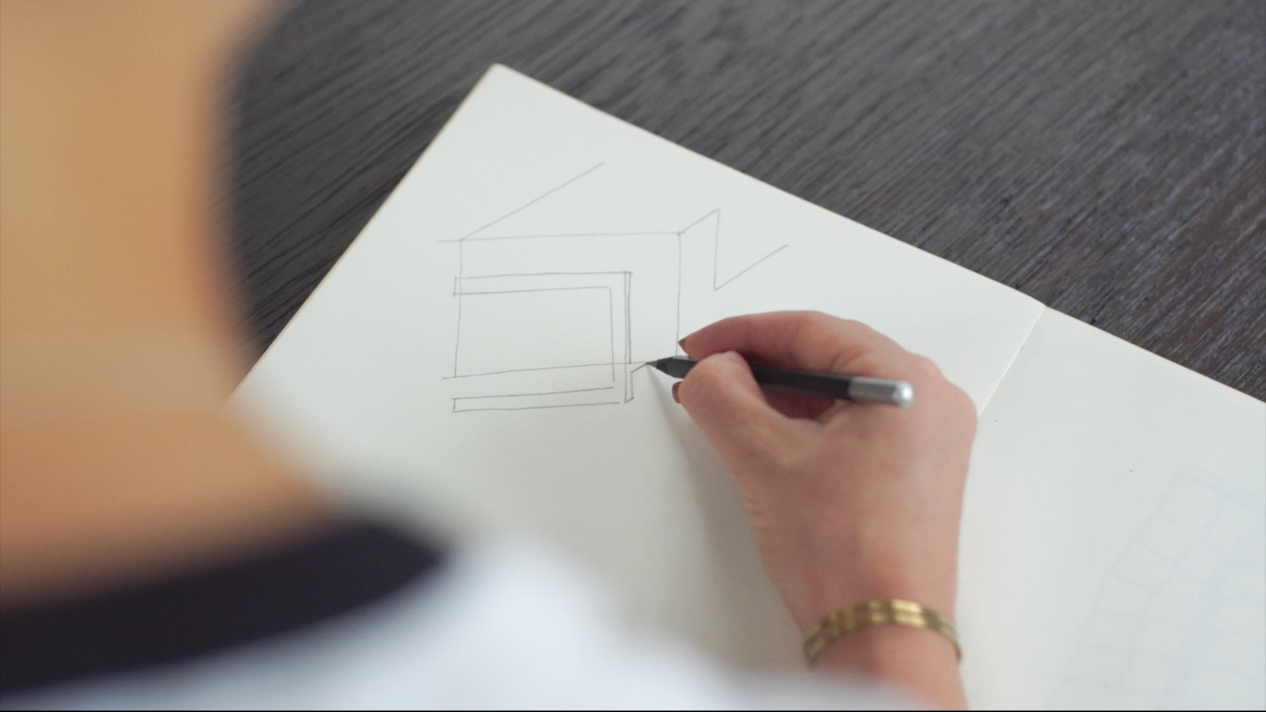 Designer Malene Lillelund drawing a sketch